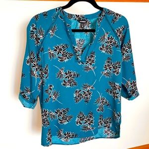Express size XS teal and black floral top